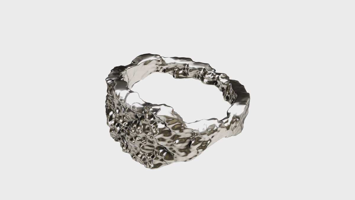 Distorted Silverring rotating: a solid 925 silver band with an eroded, pitted surface